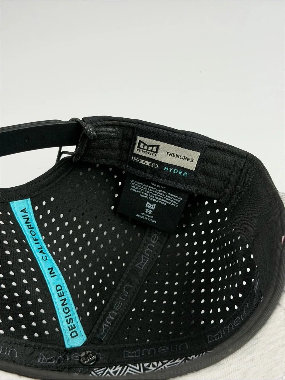 Melin Trenches Icon Hydro Performance Snapback Hat in Black, Classic